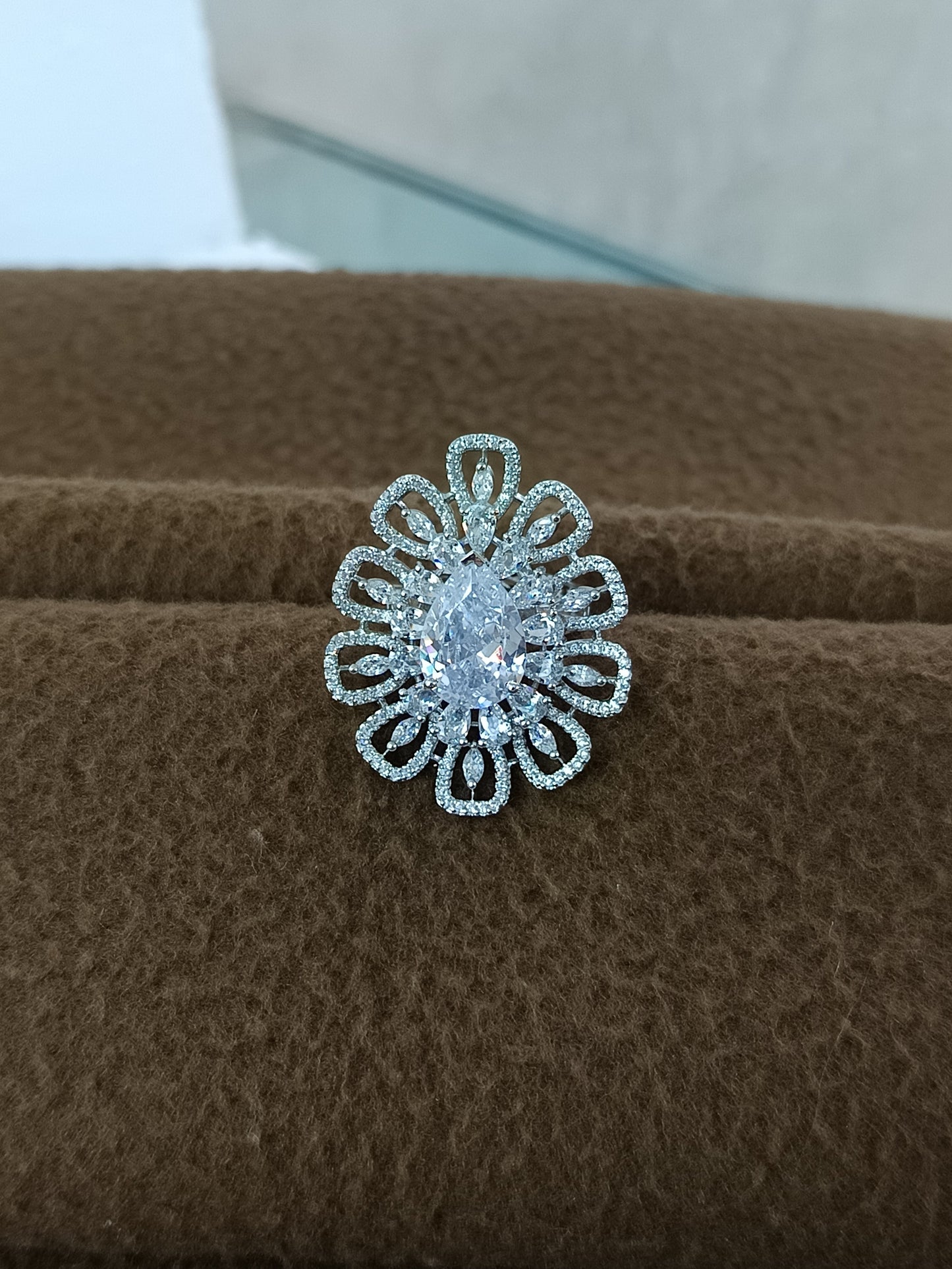 "Radiant Bloom – Premium Platinum-Plated AD Finger Ring with Pear-Cut Center Gemstone"
