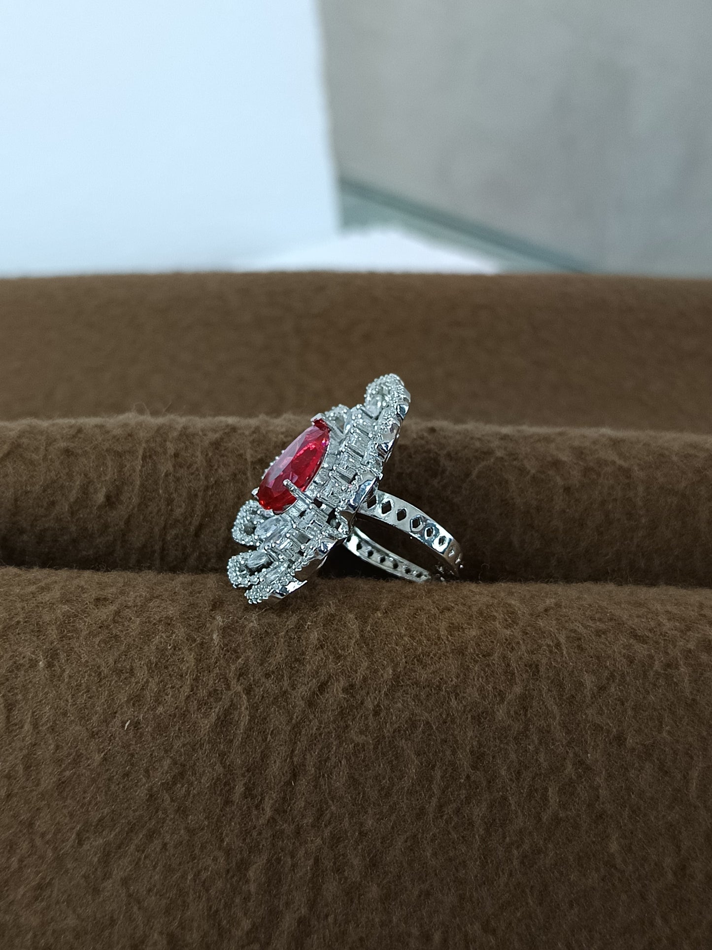 "Radiant Bloom – Premium Platinum-Plated AD Finger Ring with Pear-Cut Center Gemstone"