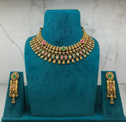 Gold necklace with colorful stones