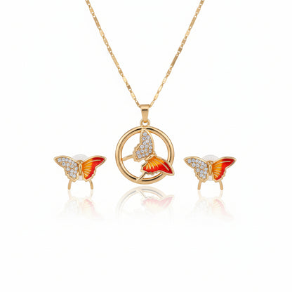 Butterfly-shaped earrings on a hand with a visible brand tag.