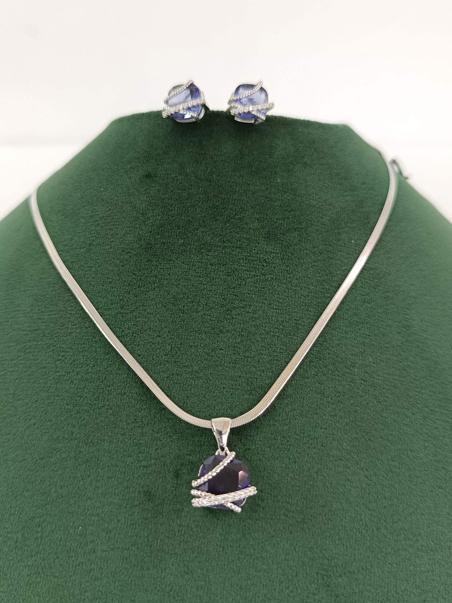 "Silver Serenity: American Blue Dazzle Diamond Pendant Set"