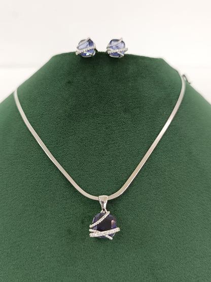 "Silver Serenity: American Blue Dazzle Diamond Pendant Set"