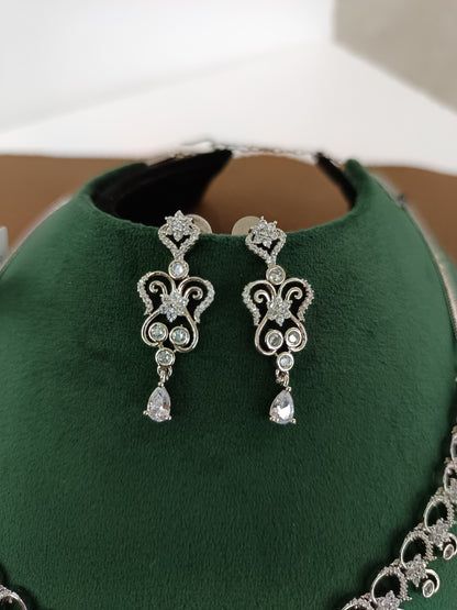"Rhodium Brilliance: American Diamond Swirl Necklace Set"