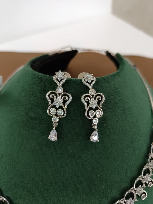 "Rhodium Brilliance: American Diamond Swirl Necklace Set"
