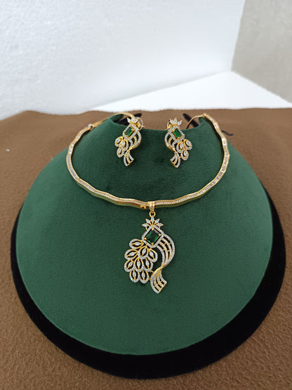 Peacock Elegance – Gold & Rhodium-Plated American Diamond Pendant Set with Green Stone Accent