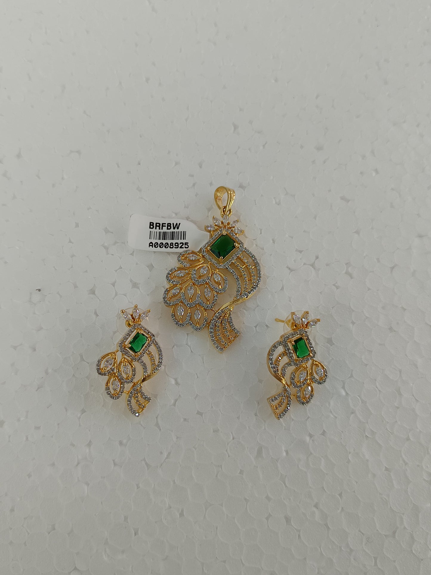 Peacock Elegance – Gold & Rhodium-Plated American Diamond Pendant Set with Green Stone Accent