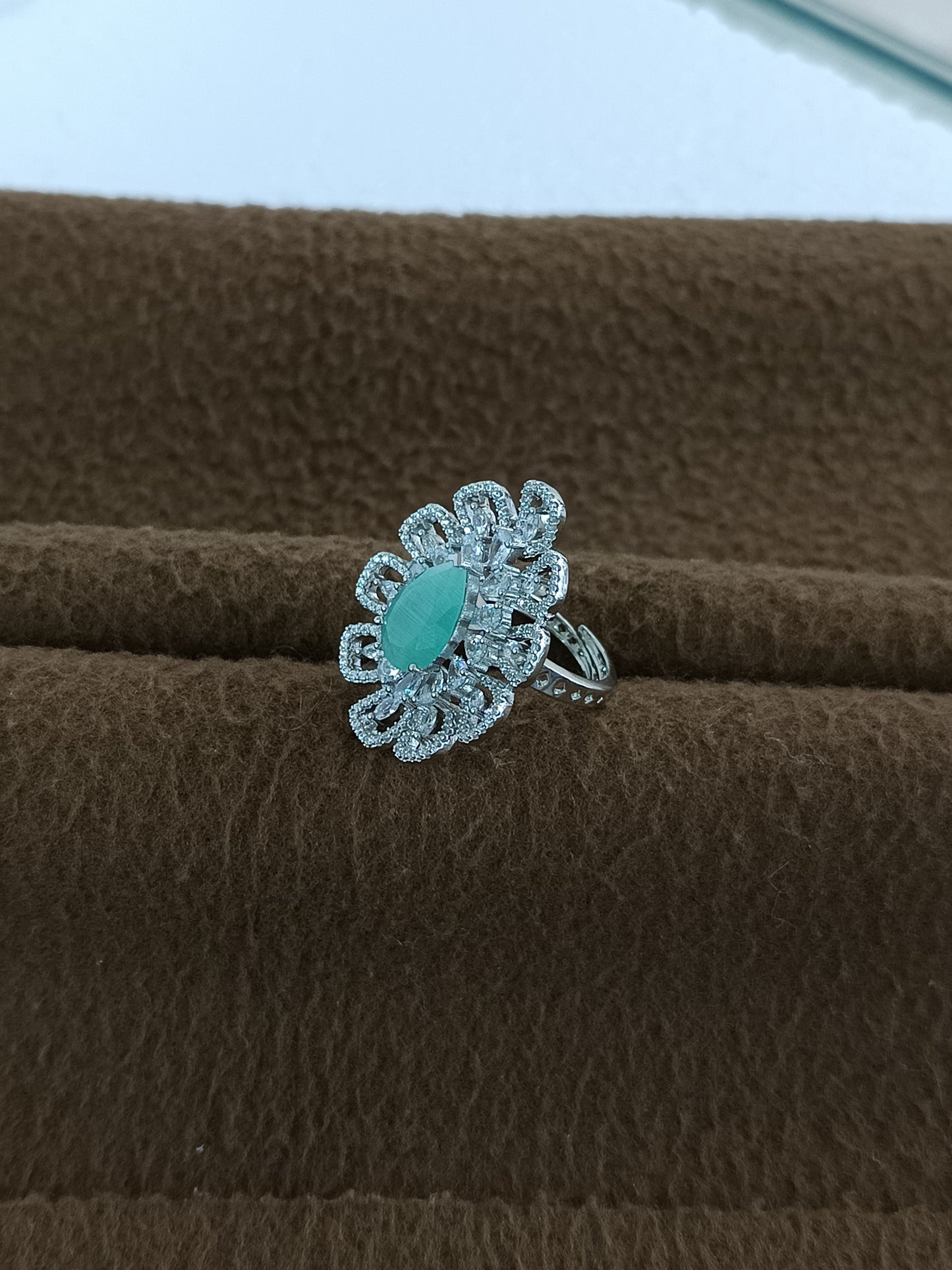 "Radiant Bloom – Premium Platinum-Plated AD Finger Ring with Pear-Cut Center Gemstone"