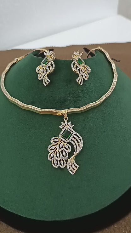 Peacock Elegance – Gold & Rhodium-Plated American Diamond Pendant Set with Green Stone Accent