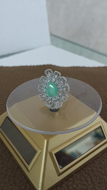 "Radiant Bloom – Premium Platinum-Plated AD Finger Ring with Pear-Cut Center Gemstone"