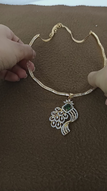 Peacock Elegance – Gold & Rhodium-Plated American Diamond Pendant Set with Green Stone Accent