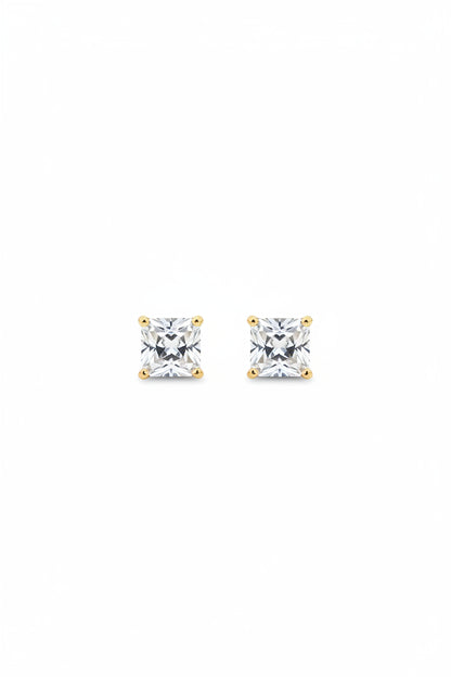 Pair of delicate gold-plated princess cut square solitaire stud earrings displayed on a premium black cloth background.