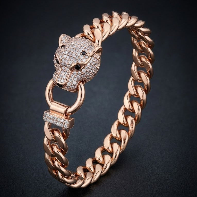 Rose gold bracelet with panther head design on a dark background