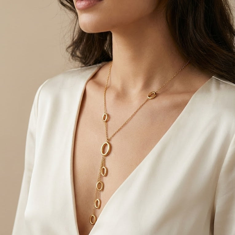Gold Toned Necklace with Interlocking ring pendent